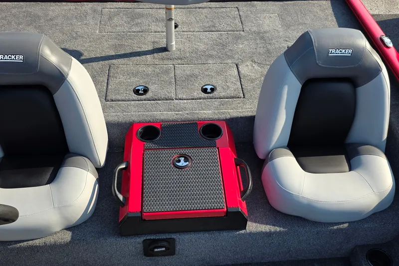 Slide: The Image of Interior of 2027 Tracker Savage 215 boat with two seats and a central console. - 25