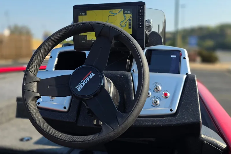 Slide: The Image of Steering console of 2027 Tracker Savage 215 boat with navigation display. - 21