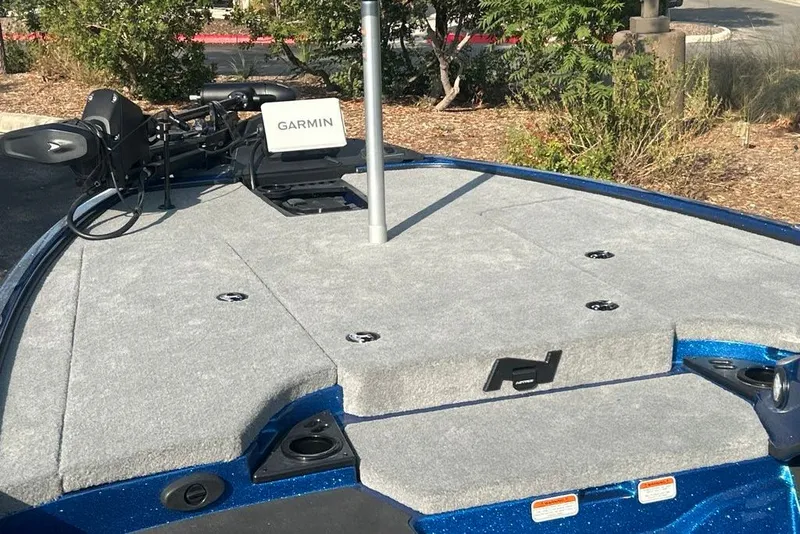 Slide: The Image of 2027 Nitro Z18 XL Pro boat deck with Garmin equipment, parked outdoors. - 7