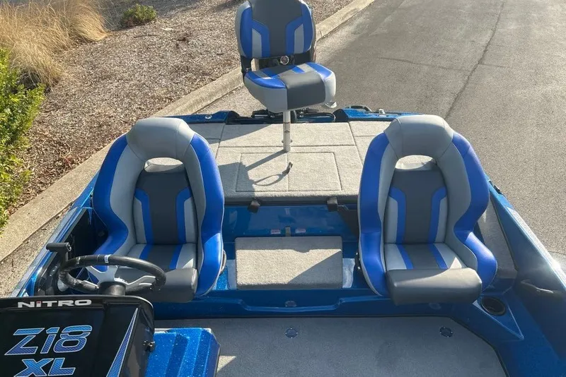 Slide: The Image of 2027 Nitro Z18 XL Pro boat interior with blue and gray seating. - 3