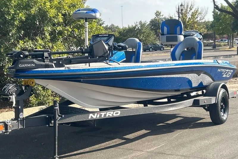 The Image of 2027 Nitro Z18 XL Pro boat on trailer, featuring Garmin equipment, parked outdoors. - 0
