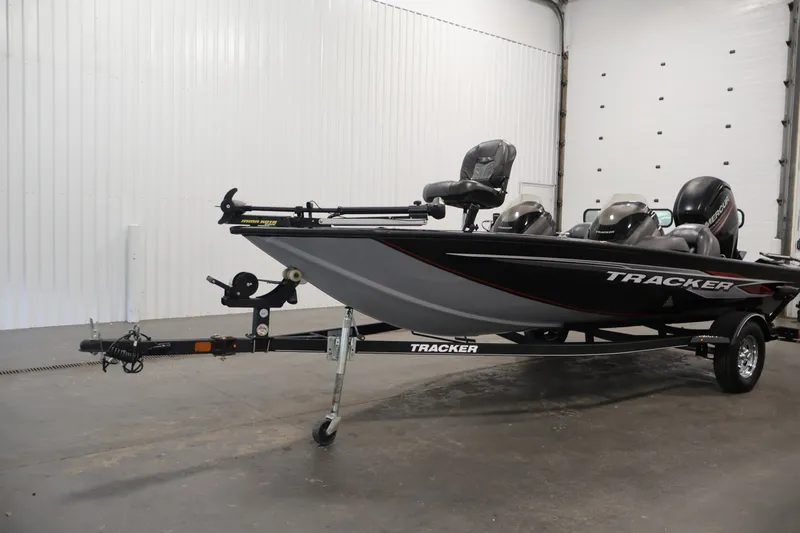 Slide: The Image of 2019 Tracker Pro Team 175 TXW fishing boat on trailer in indoor setting. - 48