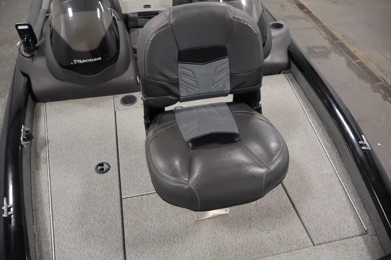 Slide: The Image of 2019 Tracker Pro Team 175 TXW boat interior with gray seating and carpeted flooring. - 14