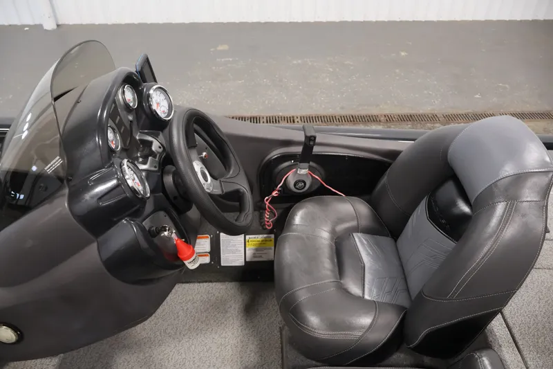 Slide: The Image of 2019 Tracker Pro Team 175 TXW boat cockpit with steering wheel and gauges. - 23