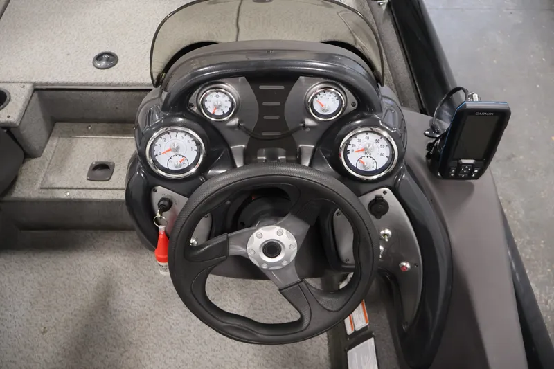 Slide: The Image of 2019 Tracker Pro Team 175 TXW boat dashboard with gauges and Garmin device. - 24