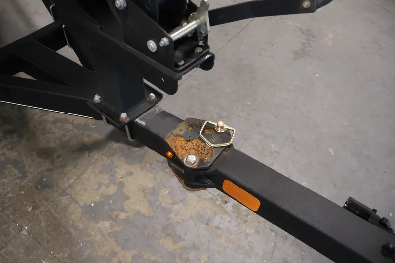 Slide: The Image of 2019 Tracker Pro Team 175 TXW trailer hitch with rust and safety pin. - 50