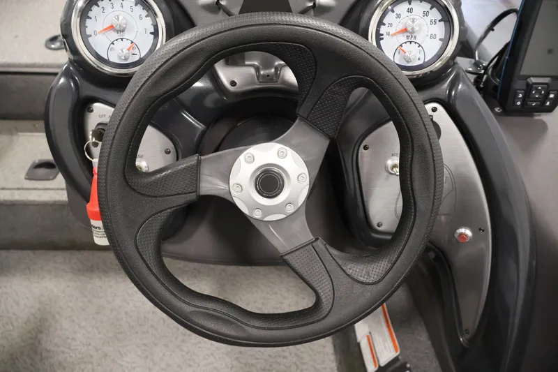 Slide: The Image of Steering wheel and dashboard of 2019 Tracker Pro Team 175 TXW boat. - 25