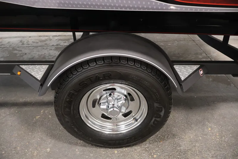 Slide: The Image of 2019 Tracker Pro Team 175 TXW trailer wheel with chrome rim and fender. - 49