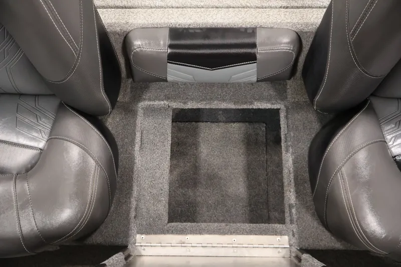 Slide: The Image of 2019 Tracker Pro Team 175 TXW boat interior with gray seating and storage compartment. - 36