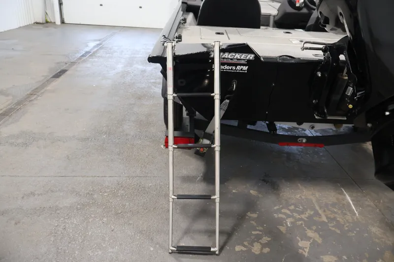 Slide: The Image of 2019 Tracker Pro Team 175 TXW boat with ladder in a garage setting. - 42