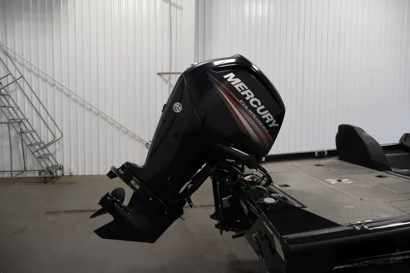 Slide: The Image of 2019 Tracker Pro Team 175 TXW with Mercury outboard motor in a garage setting. - 44