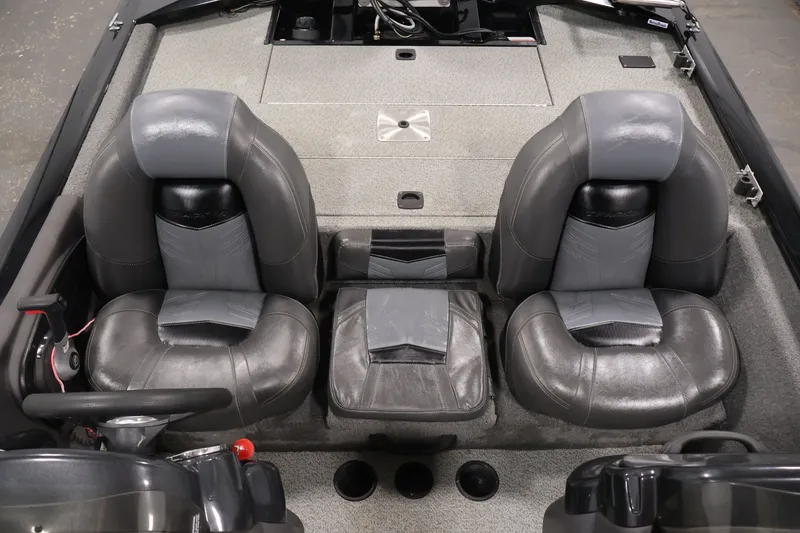 Slide: The Image of 2019 Tracker Pro Team 175 TXW boat interior with dual gray seats and center console. - 35