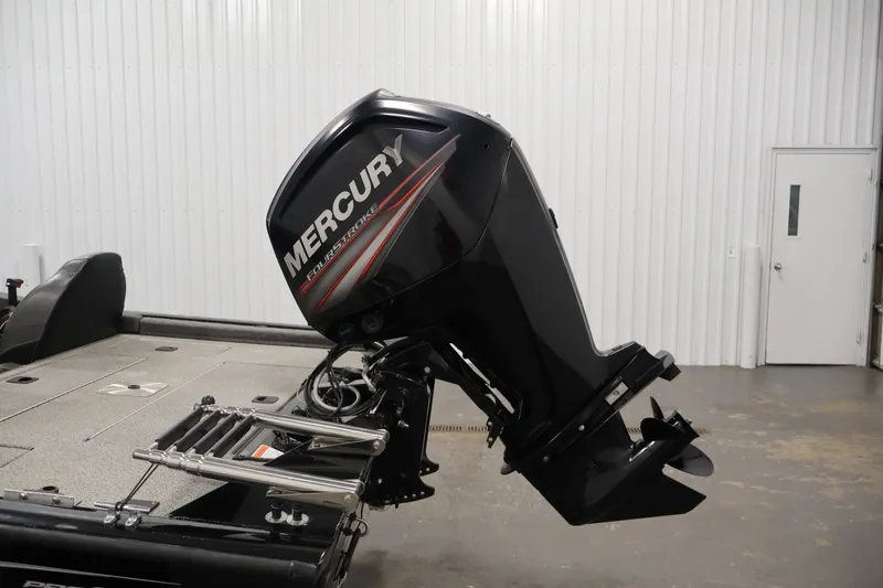 Slide: The Image of 2019 Tracker Pro Team 175 TXW with Mercury FourStroke outboard motor in a garage. - 43
