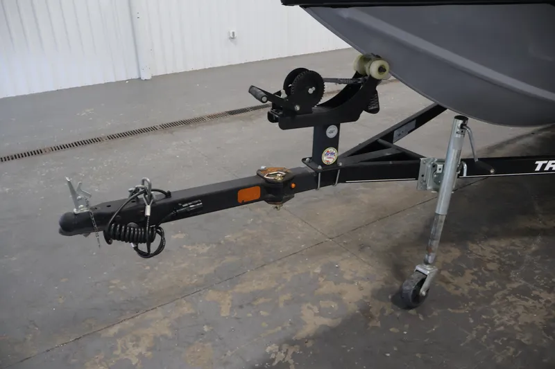 Slide: The Image of 2019 Tracker Pro Team 175 TXW boat trailer hitch and winch in a garage setting. - 47