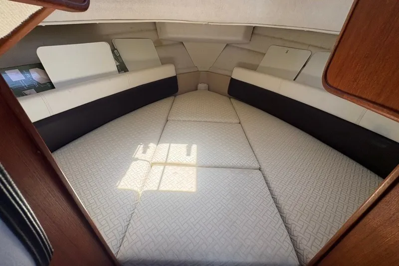 Slide: The Image of 2017 Ranger Tugs R-27 cabin interior with cushioned sleeping area. - 45