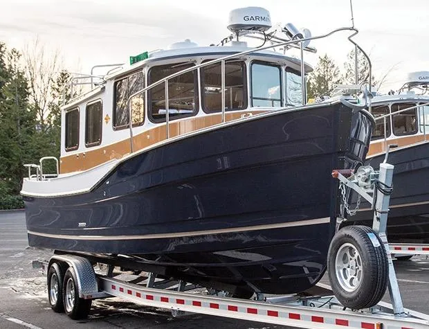 Slide: The Image of Manufacturer Provided Image: 2017 Ranger Tugs R-27 boat on a trailer in a parking lot. - 74