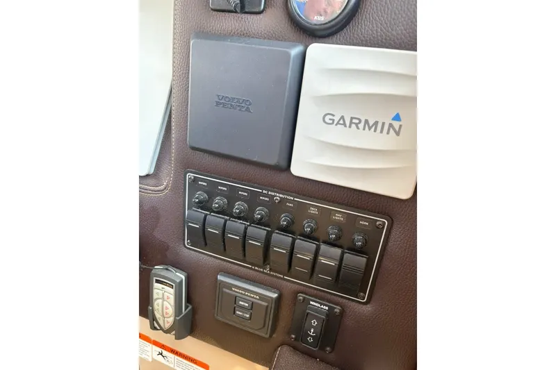 Slide: The Image of Control panel of 2017 Ranger Tugs R-27 with Garmin and Volvo Penta components. - 32