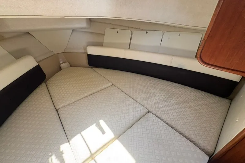 Slide: The Image of 2017 Ranger Tugs R-27 cabin interior with cushioned sleeping area. - 46