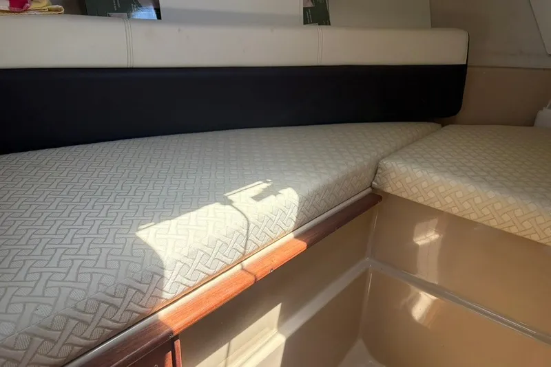 Slide: The Image of Interior cabin seating of 2017 Ranger Tugs R-27 with patterned cushions. - 44