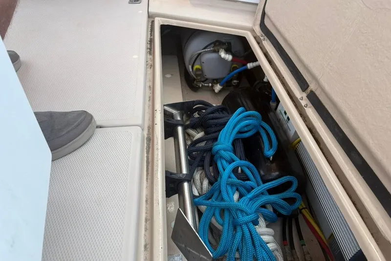 Slide: The Image of Storage compartment of 2017 Ranger Tugs R-27 with ropes and equipment. - 67