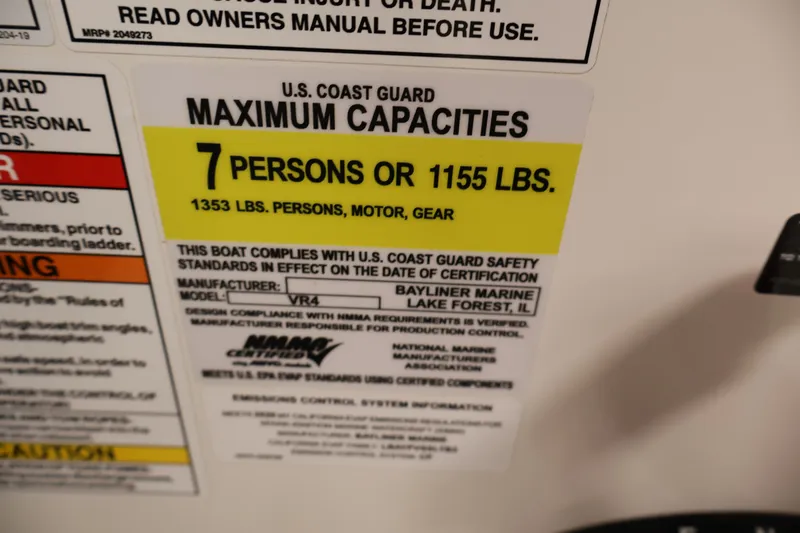 Slide: The Image of 2020 Bayliner VR4 Bowrider I/O capacity label: 7 persons or 1155 lbs, U.S. Coast Guard compliant. - 25