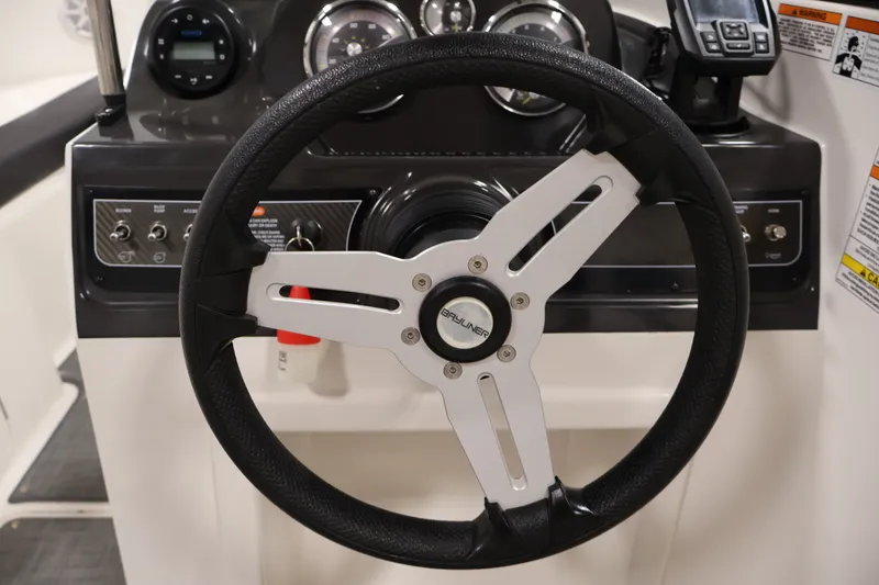 Slide: The Image of 2020 Bayliner VR4 Bowrider I/O steering wheel and dashboard controls. - 19