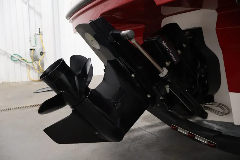 Slide: The Image of 2020 Bayliner VR4 Bowrider I/O boat with MerCruiser outdrive in a garage setting. - 44