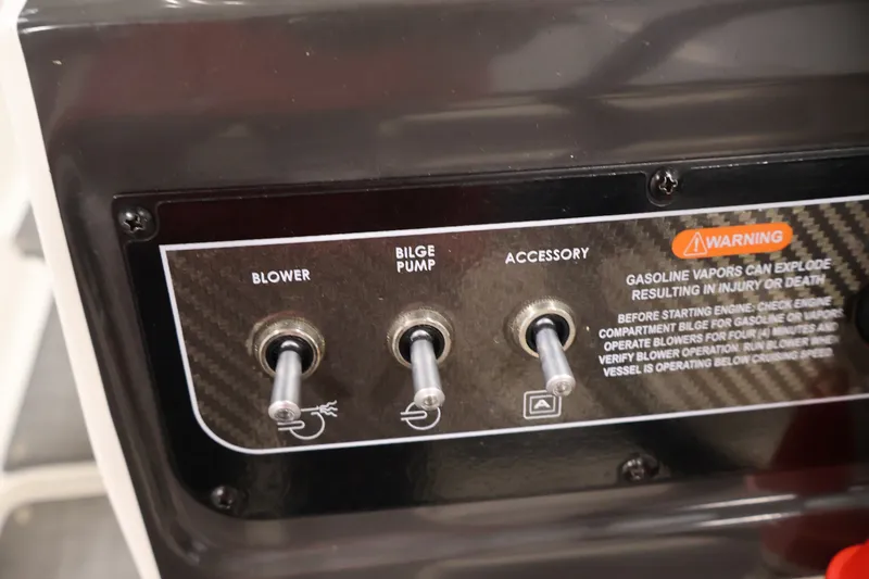 Slide: The Image of Control panel of a 2020 Bayliner VR4 Bowrider I/O with blower, bilge pump, and accessory switches. - 23