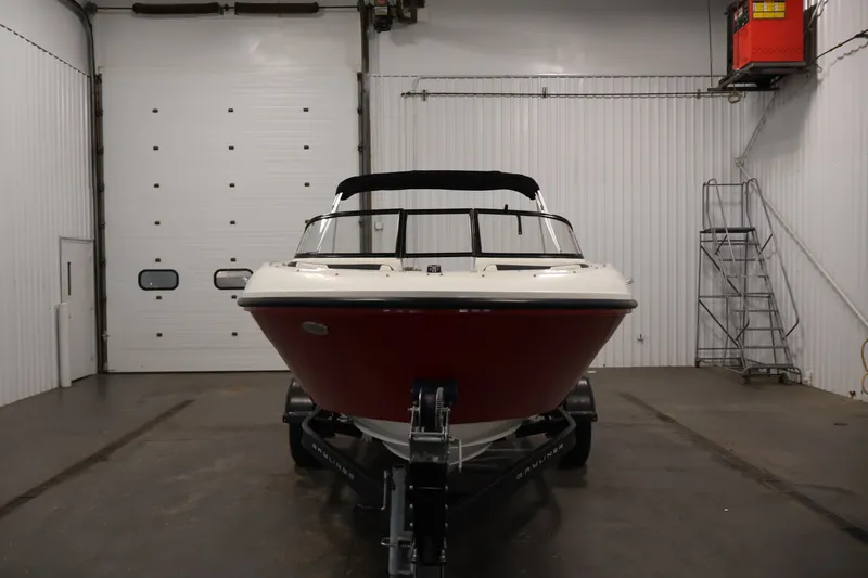 Slide: The Image of 2020 Bayliner VR4 Bowrider I/O in a garage, front view. - 2