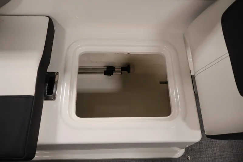Slide: The Image of 2020 Bayliner VR4 Bowrider I/O storage compartment with open hatch, showcasing interior space. - 36