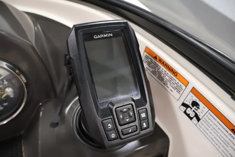 Slide: The Image of Garmin device on 2020 Bayliner VR4 Bowrider I/O dashboard with warning labels. - 22
