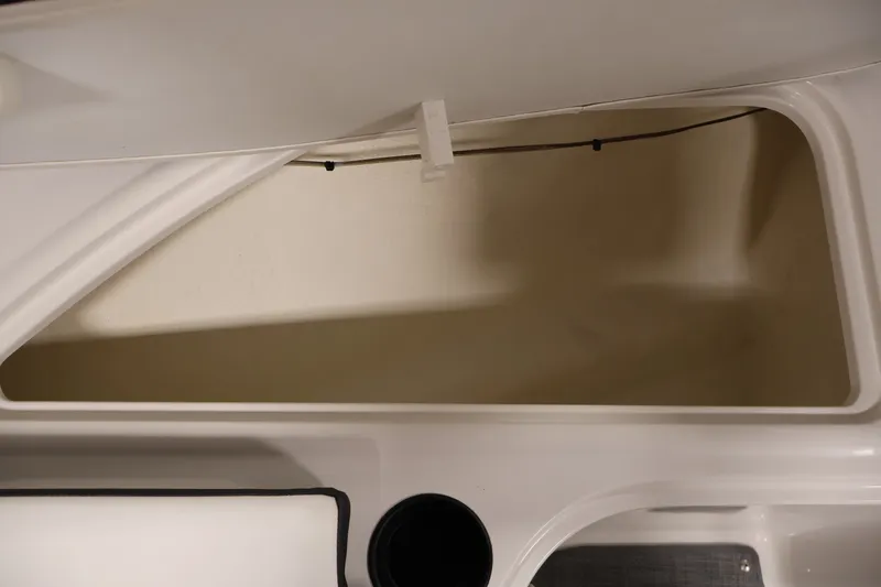Slide: The Image of 2020 Bayliner VR4 Bowrider I/O storage compartment, open lid, spacious interior view. - 16