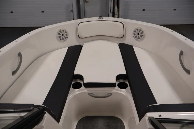 Slide: The Image of 2020 Bayliner VR4 Bowrider I/O interior with cushioned seating and built-in speakers. - 11