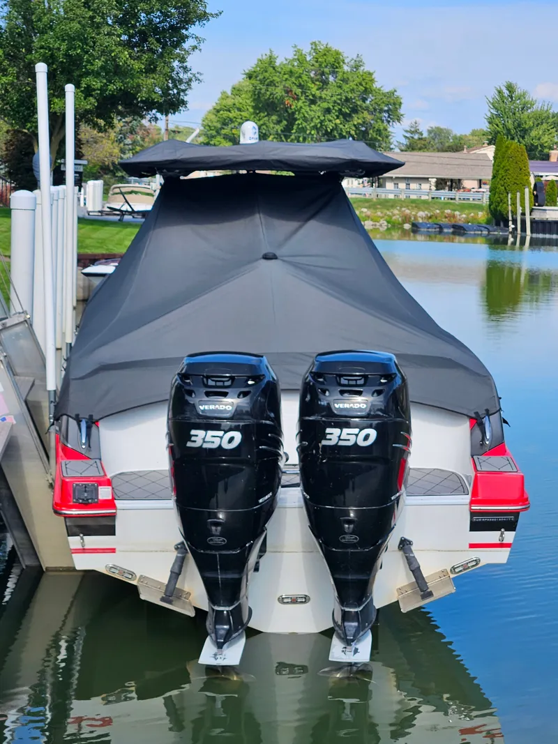 Slide: The Image of A 2017 Sunsation 32 CCX with twin 350 HP engines, docked at a calm pier. - 19