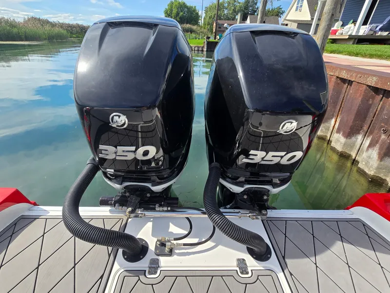 Slide: The Image of Two powerful 350 HP outboard engines on a boat at the dock. - 4