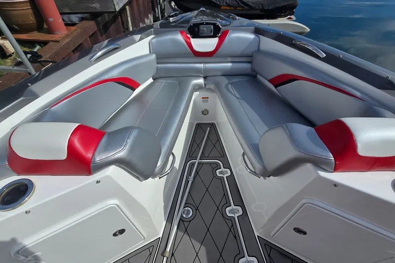Slide: The Image of The image shows the cockpit of a 2017 Sunsation 32 CCX with gray and red upholstery. - 15