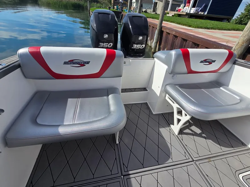Slide: The Image of The image shows the stern of a 2017 Sunsation 32 CCX with two seats and two outboard engines. - 5