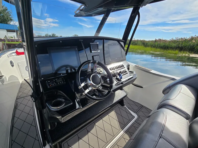 Slide: The Image of The image shows the cockpit of a 2017 Sunsation 32 CCX with modern instruments and a sleek steering wheel. - 10