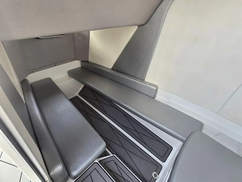 Slide: The Image of Interior of a 2017 Sunsation 32 CCX with gray upholstery and textured flooring. - 13