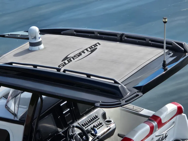 Slide: The Image of The image shows the cockpit of a 2017 Sunsation 32 CCX with a modern helm. - 3