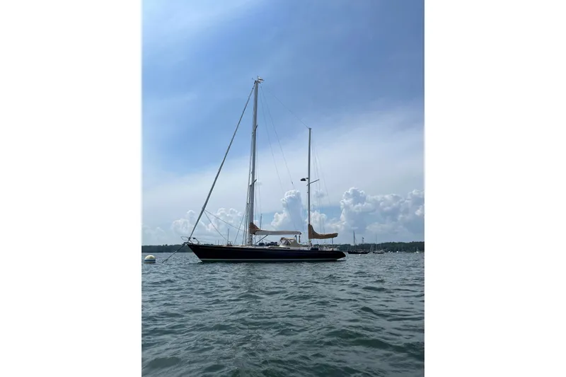 Slide: The Image of Sailboat on water, 1984 Ta Shing Skye 54, under a clear blue sky. - 8