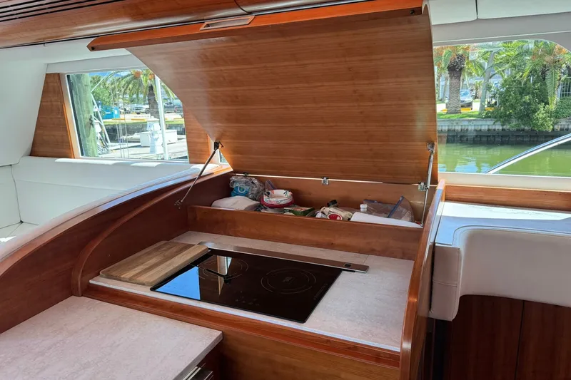 Slide: The Image of Luxurious 2001 Southern Composite Sportfish yacht interior with modern kitchen amenities. - 16