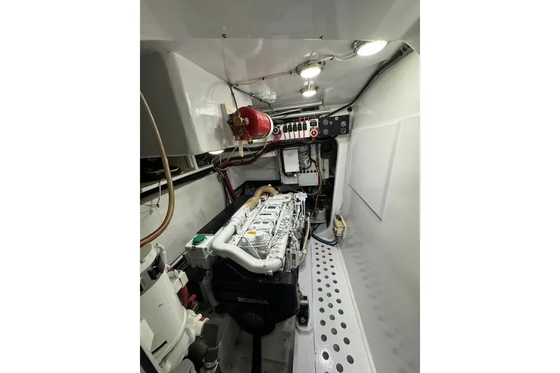 Slide: The Image of Engine room of a 2001 Southern Composite Sportfish boat, featuring a Scania engine. - 24