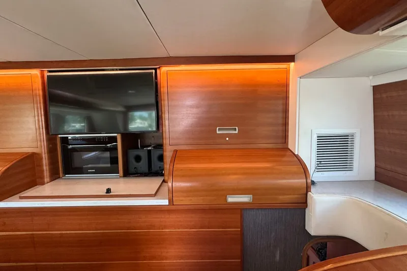 Slide: The Image of Luxurious interior of a 2001 Southern Composite Sportfish yacht with wood paneling and modern amenities. - 17