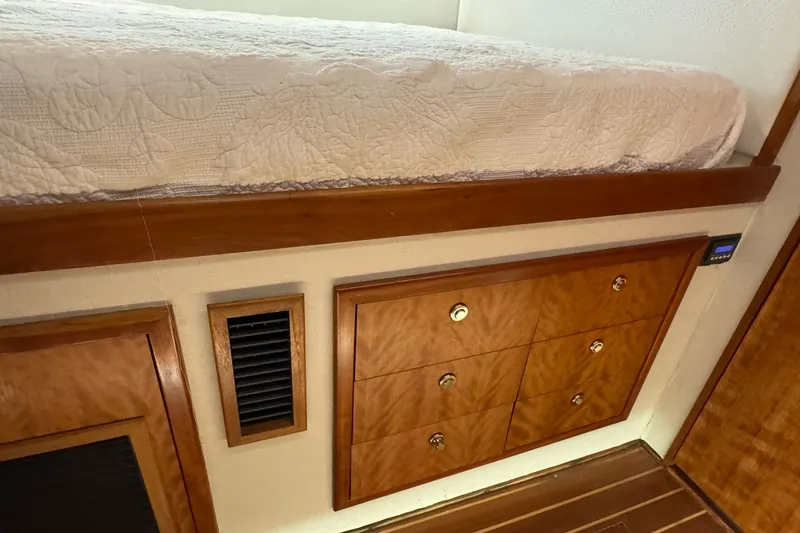 Slide: The Image of Interior of 2001 Southern Composite Sportfish with wooden cabinetry and bed. - 21