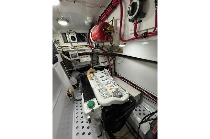 Slide: The Image of Engine room of a 2001 Southern Composite Sportfish boat, featuring organized wiring and equipment. - 26