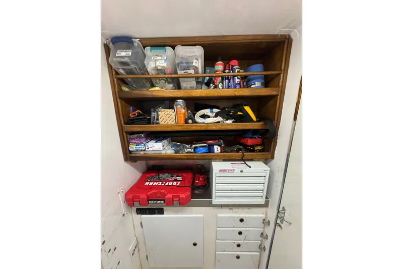 Slide: The Image of Organized storage shelves with tools and supplies on a 2001 Southern Composite Sportfish boat. - 27
