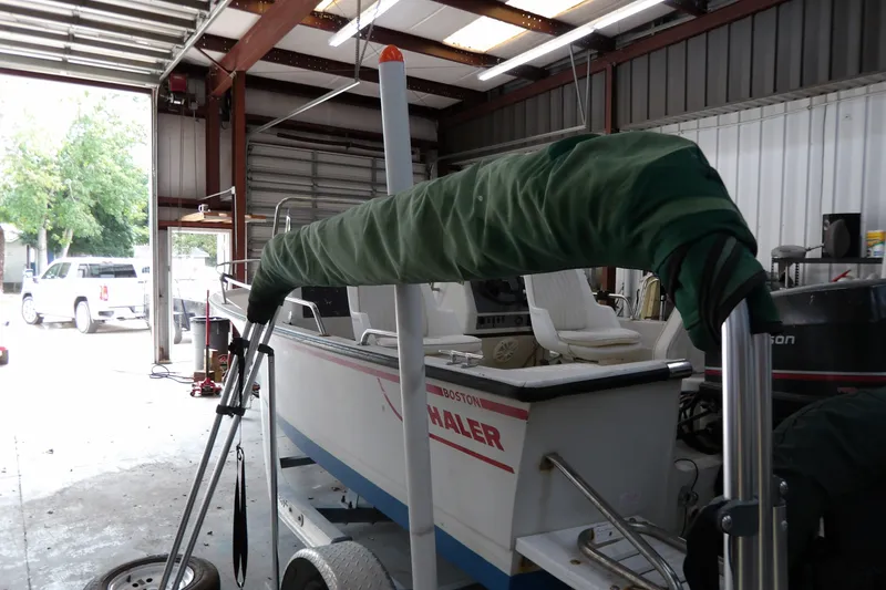 Slide: The Image of 2000 Starcraft C-Star 170 DC boat in garage, covered and on trailer. - 21