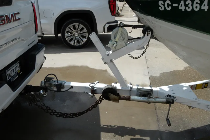 Slide: The Image of GMC truck towing a 2000 Starcraft C-Star 170 DC boat on a trailer. - 19