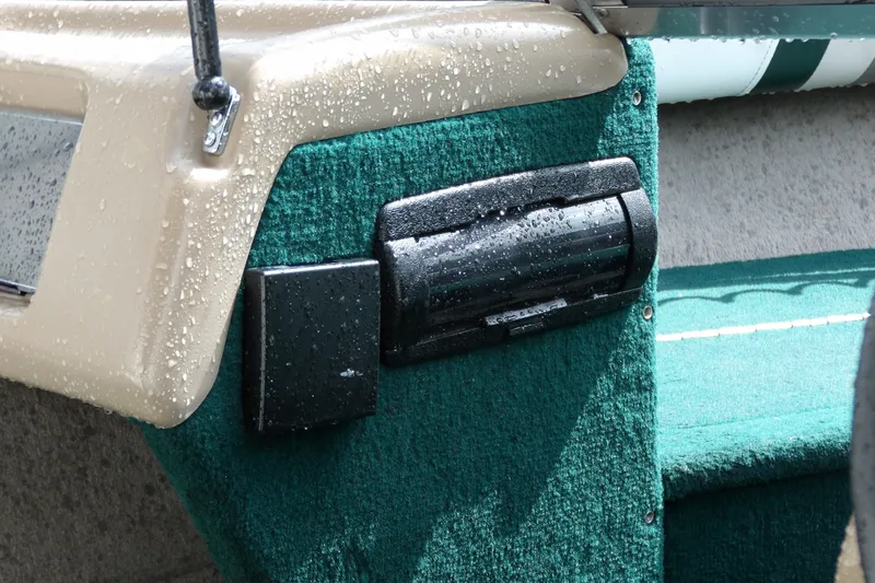 Slide: The Image of Wet interior of a 2000 Starcraft C-Star 170 DC boat with green upholstery. - 14